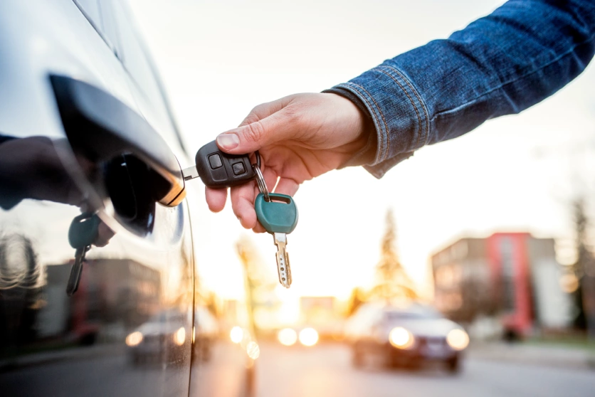 opening the door to your new rental with America First Rent-A-Car